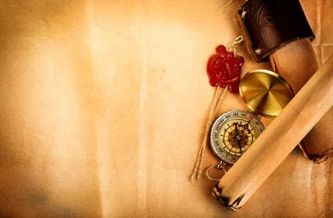 Compass, ancient scroll with red wax seal on old paper as a background Stock Photos