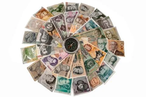 Compass and banknotes of many countries Stock Photos