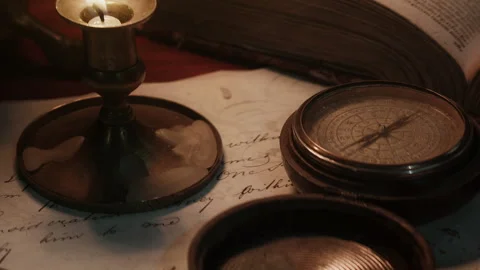 Compass and Candlelight in an old ship cabin 库存影片 259624173