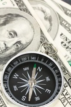 Compass and dollar Stock Photos