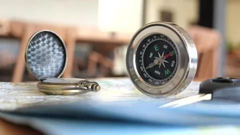 Compass and map displayed on table for navigation planning Stock Footage 320378321