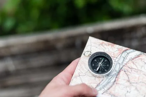 Compass and map in hand Stock Photos