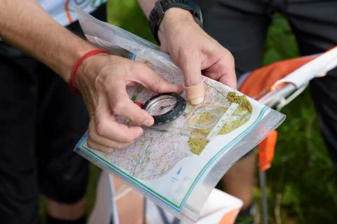 Compass and map for orienteering Stock Photos