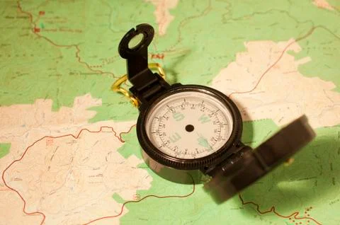 A compass and a map Stock Photos