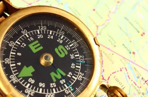 Compass and map Stock Photos