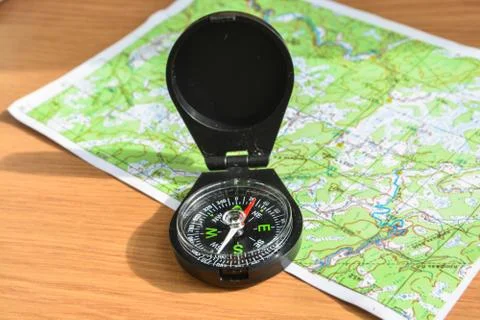 Compass and map. Stock Photos