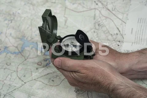 Compass and map reading survival outdoors Stock Photos