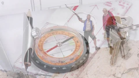 Compass and map staying central, overlay fading in, showing hikers pointing and Stock Footage 334351765