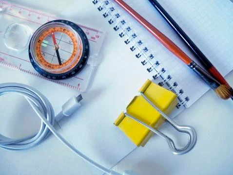 Compass and objects on a white background for travel Stock Photos