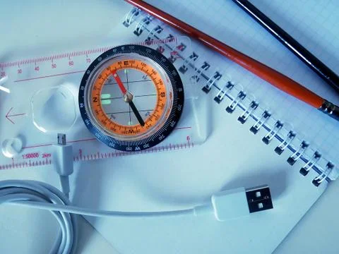 Compass and objects on a white background Stock Photos