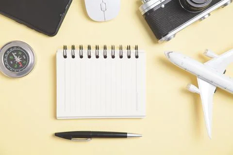 Compass and other objects on the yellow background. Travel Stock Photos