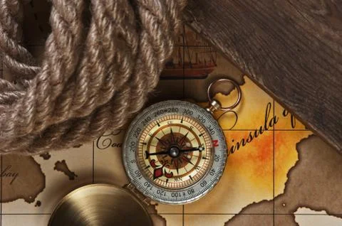 Compass and rope on map 스톡 사진