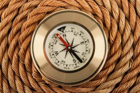 Compass and rope Stock Photos