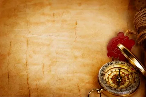 Compass and scroll with wax seal on vintage old paper background Stock Photos