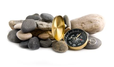 Compass and stone Stock Photos