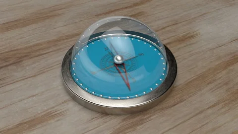 Compass animation on the table. The camera rotates, view from above. Stock Footage 115245272