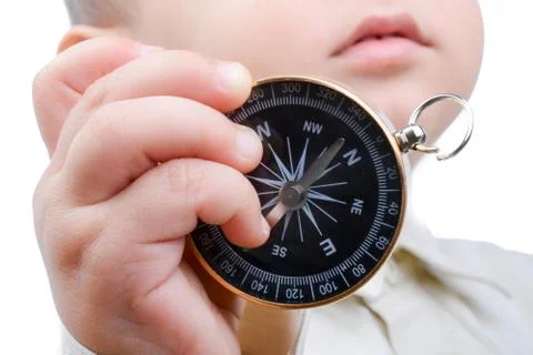 Compass in baby's hand 스톡 사진