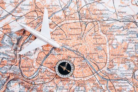 Compass on the background of the map. Magnetic compass and topographic map. Фото