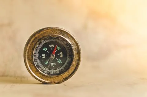 Compass on the background of old maps Stock Photos