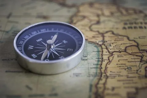 Compass on the background, old world map, vintage style, geo-navigation con.. Stock Photos
