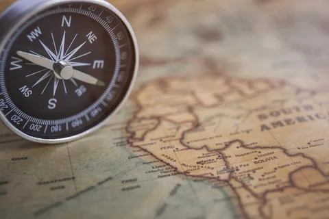 Compass on the background, old world map, vintage style, geo-navigation con.. Stock Photos