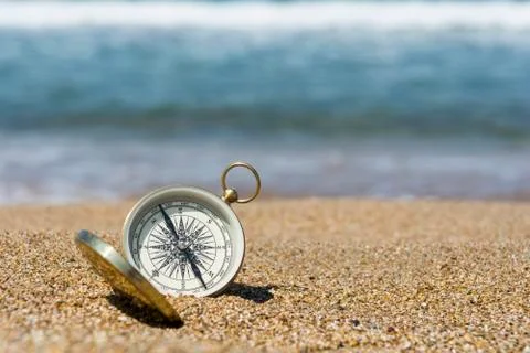 Compass on the beach Stock Photos