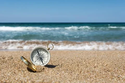 Compass on the beach Stock Photos