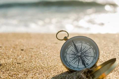 Compass on the beach Stock Photos