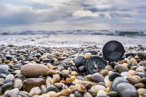 Compass on the beach Stock Photos