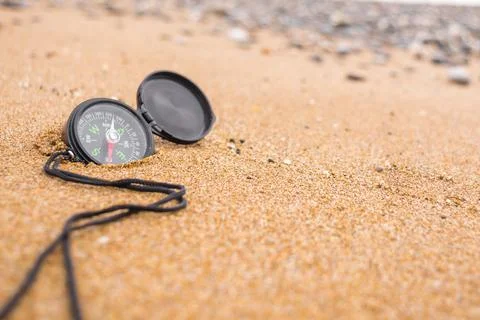 Compass on the beach Stock Photos