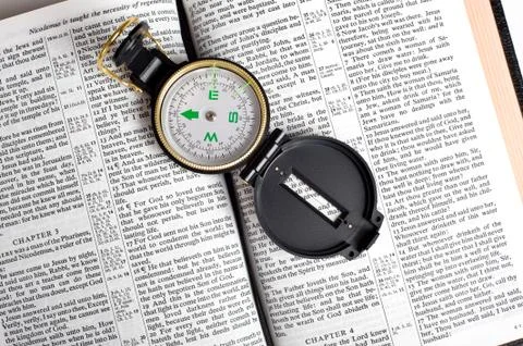 Compass on bible Stock Photos