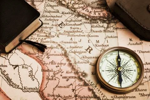 Compass, book and old map of middle east Stock Photos