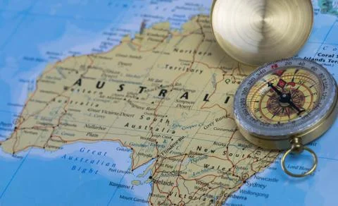 Compass on a close up map pointing at Australia and planning a travel Stock Photos