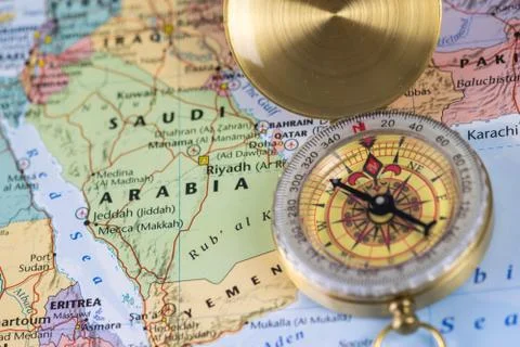 Compass on a close up map pointing at Saudi Arabia and planning a travel Stock Photos