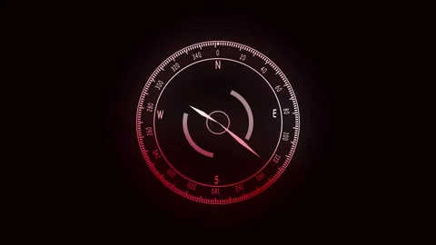 Compass dial glowing in red and white on dark background highlighting navig.. Stock Footage 321450174