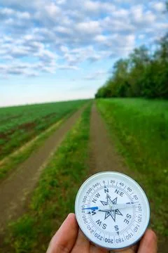 Compass direction on the plain Stock Photos