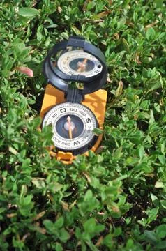 Compass in the grass. Stock Photos