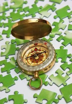 Compass on the green puzzle Foto stock
