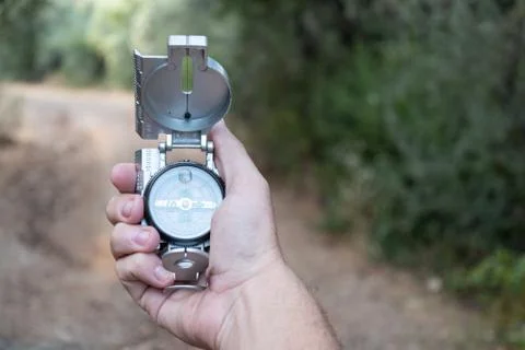 Compass in hand by a country Stock Photos