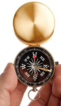 Compass in a hand isolated on white Stock Photos