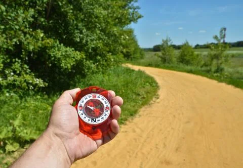 Compass in hand. Stock Photos