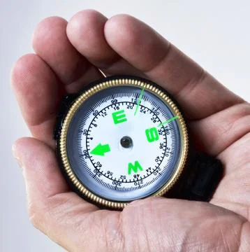 Compass in hand. Stock Photos