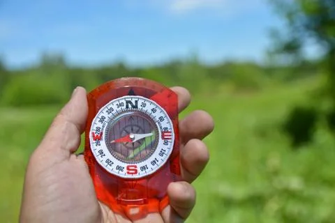Compass in hand. Stock Photos