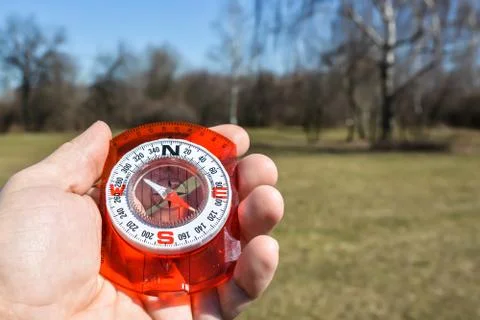 Compass in hand. Stock Photos