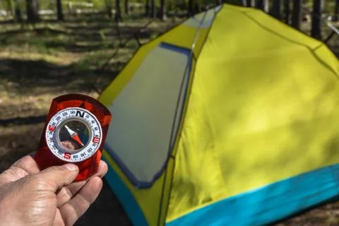 Compass in hand. Stock Photos