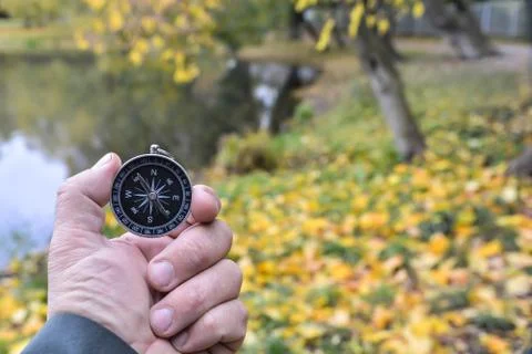 Compass in hand. Stock Photos