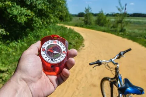 Compass in hand. Stock Photos