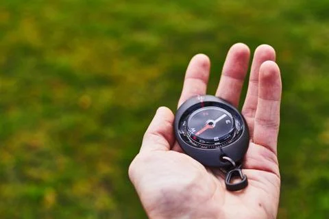 Compass on a hand Stock Photos