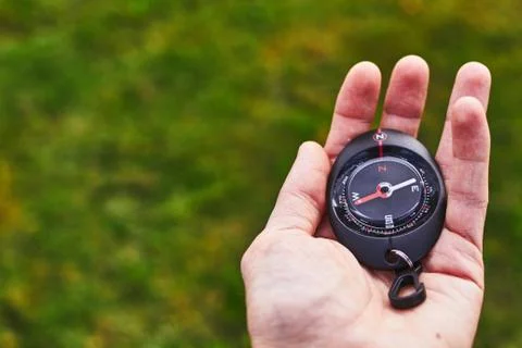 Compass on a hand Stock Photos