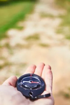 Compass on a hand Stock Photos